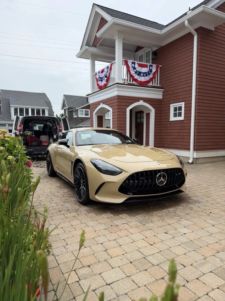 Sand colored Mercedes-AMG GT 63 coupe detailed in the driveway