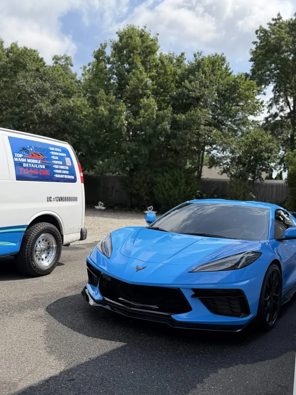 Rapid Blue C8 Corvette next to the Top Wash van