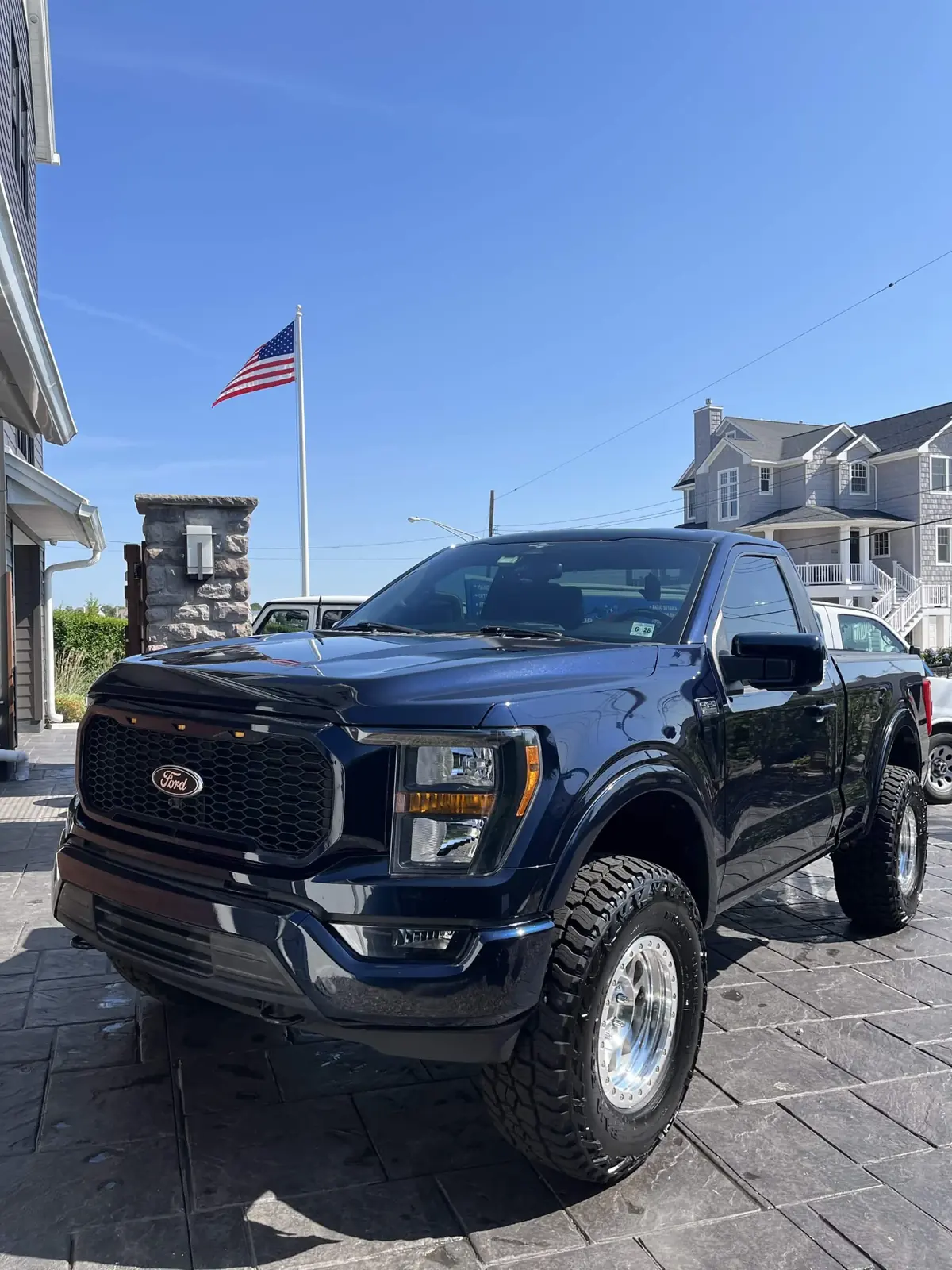 Navy Ford F-150 on polished beadlock wheels