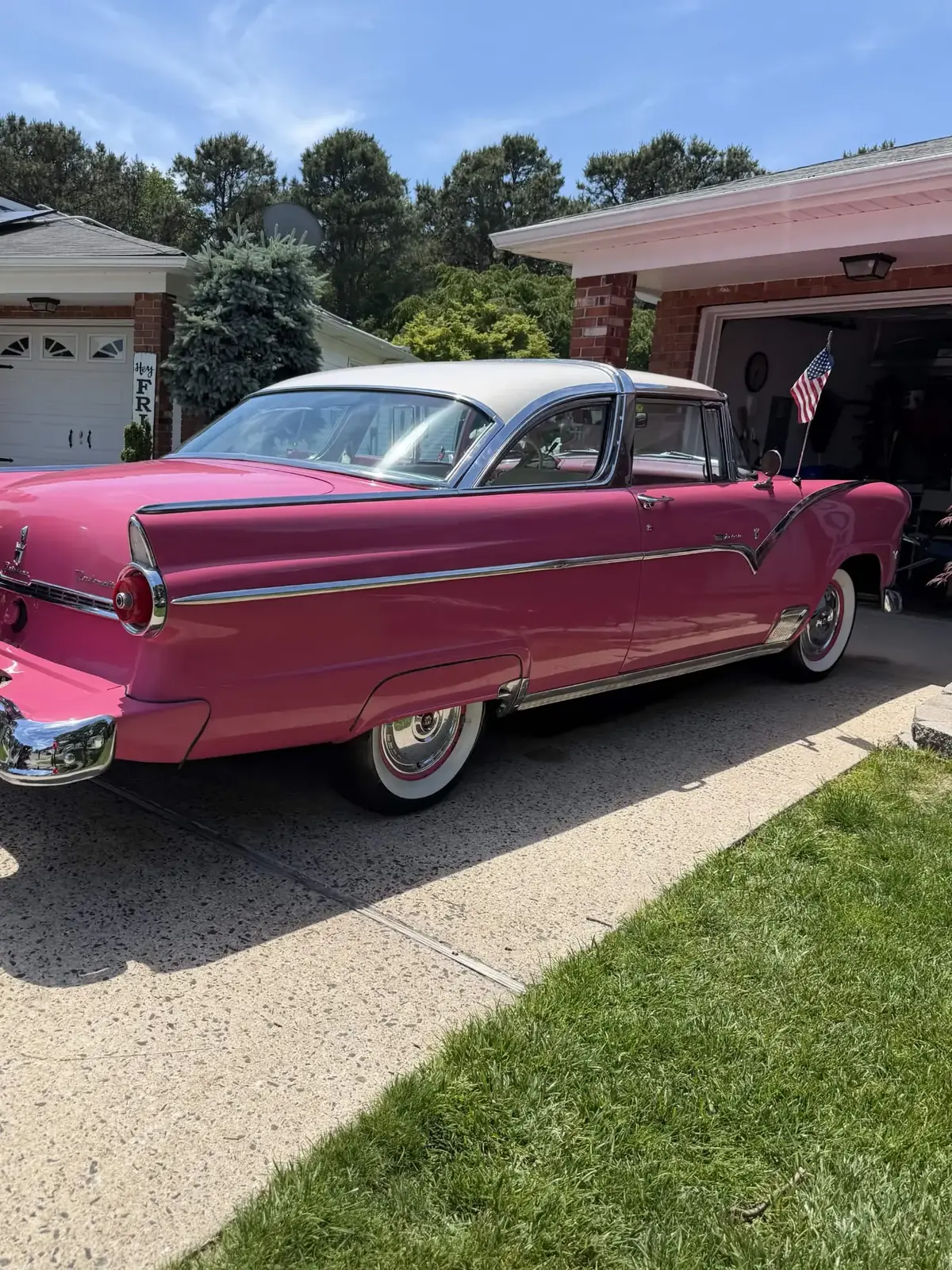 Pink and white 1955 Ford Fairlane classic