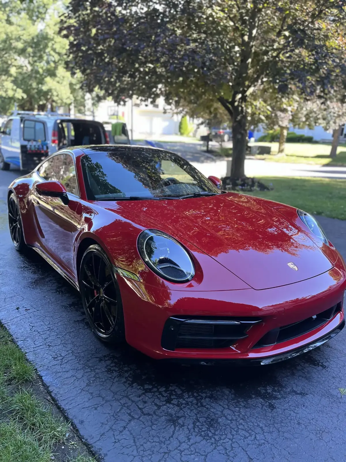 Carmine Red Porsche 911 Carrera with a mirror finish