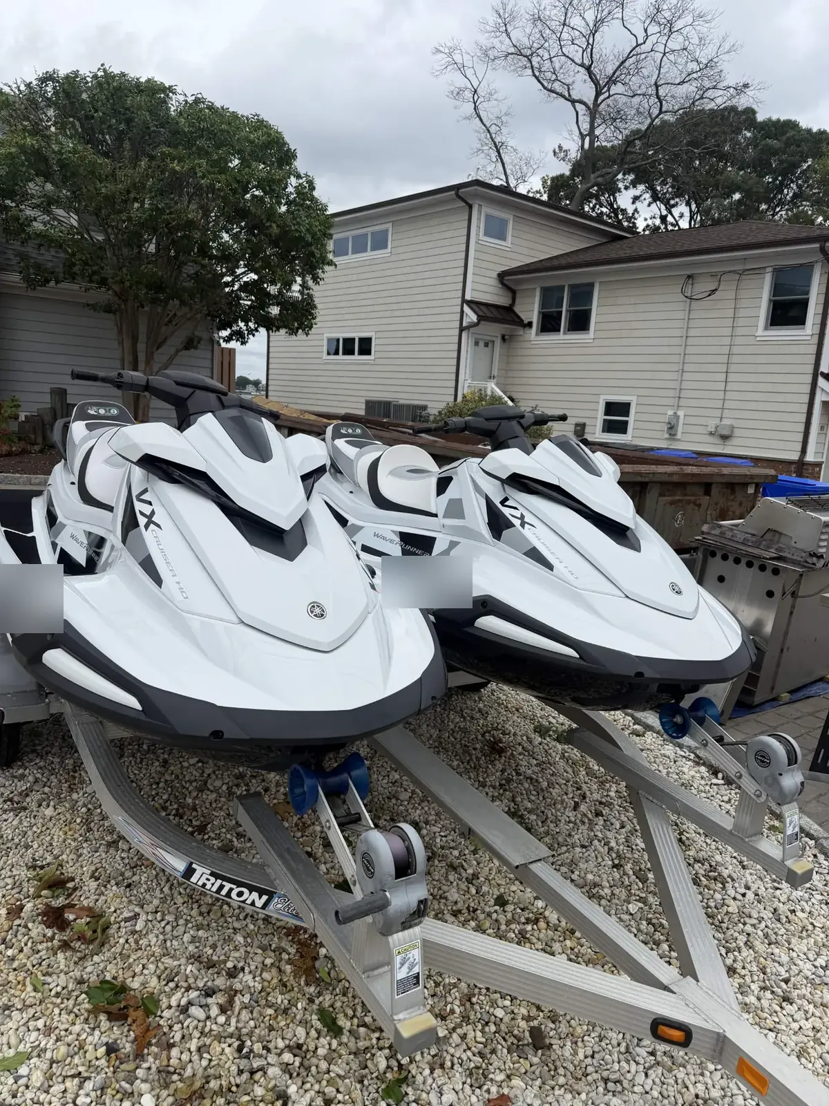 Two white Yamaha VX Cruiser WaveRunners detailed on their trailer